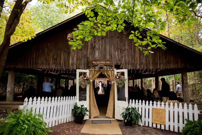Jordan & Erin embrace during their beautiful outdoor wedding at Camp Hebron.