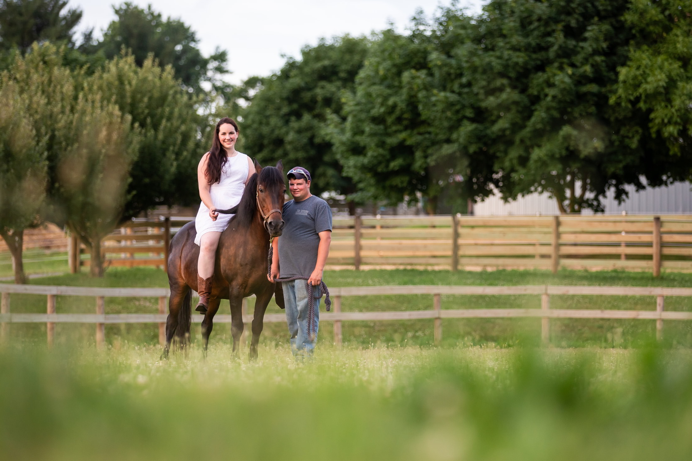 engaged couple and a horse