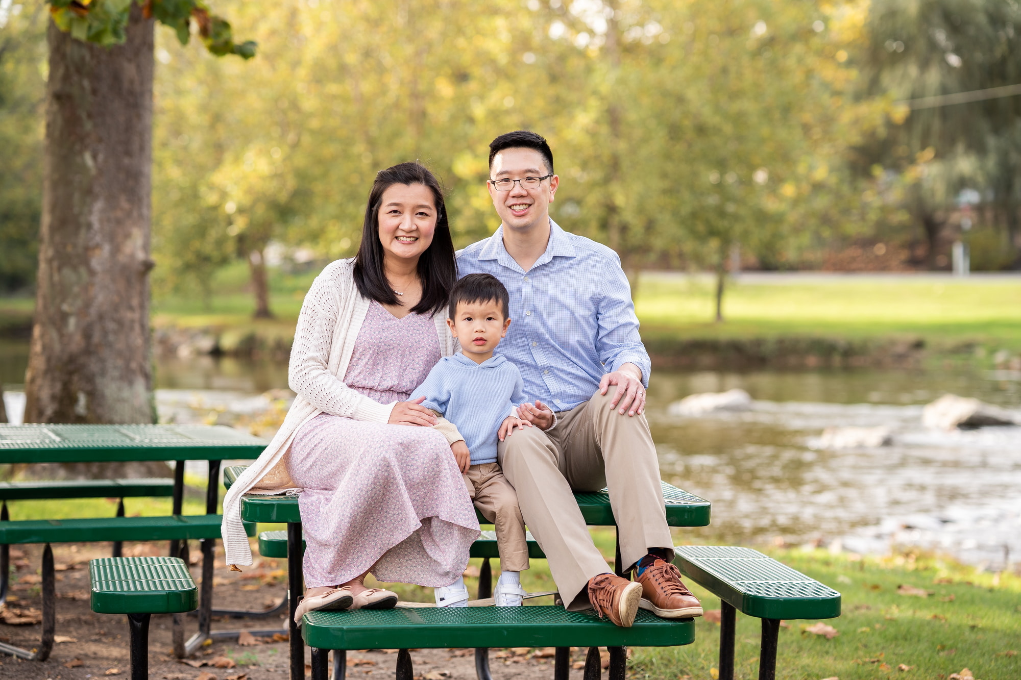 Playful family moment in leaves