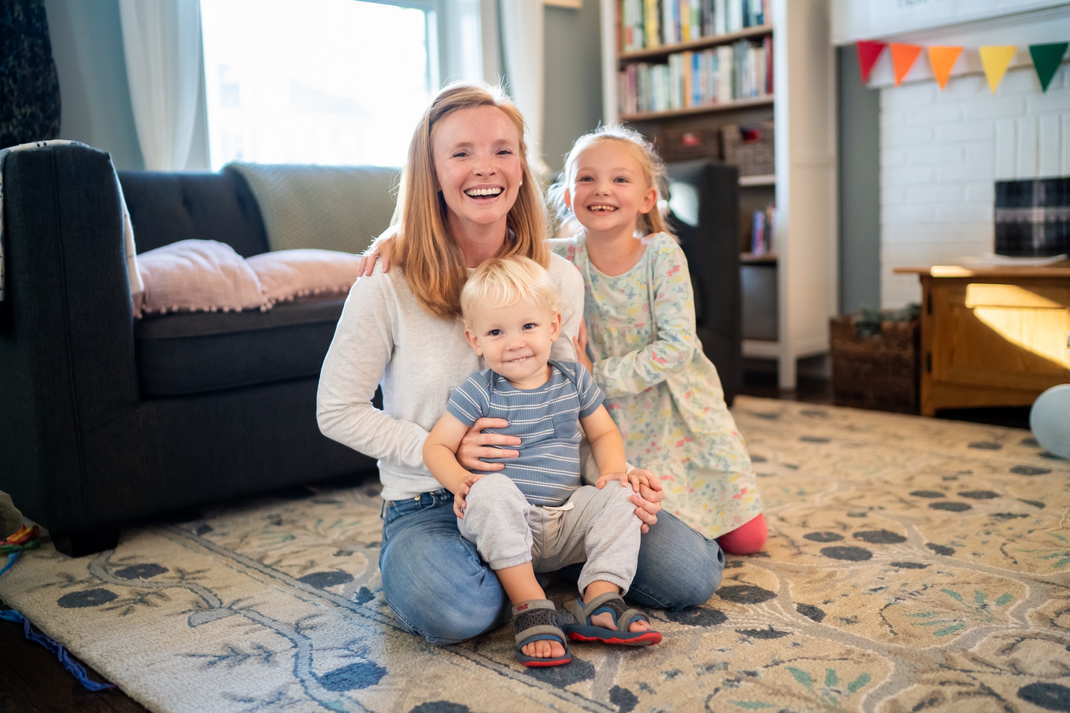 Candid family portrait capturing Jancey and her family's authentic joy and connection.