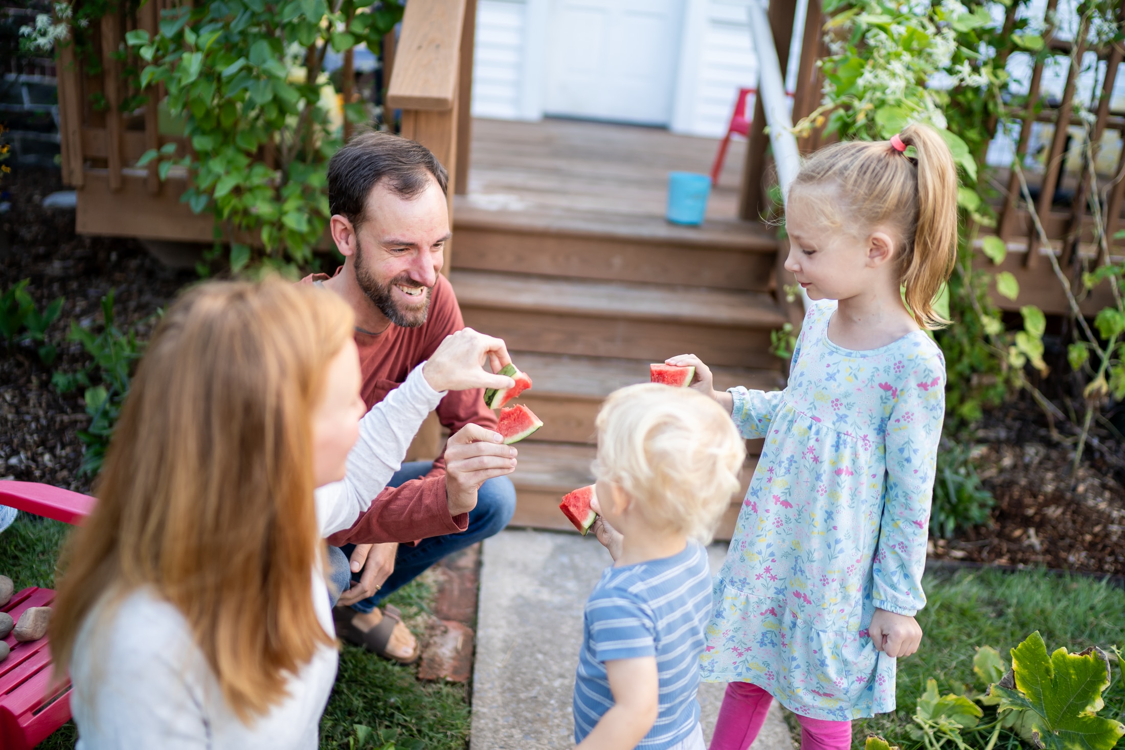 A perfect summer day captured: Jancey's family bonding over sticky watermelon slices.