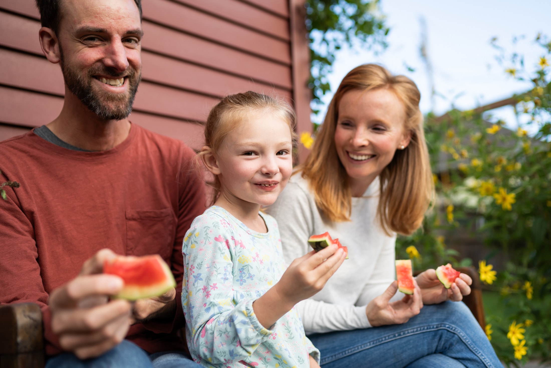 A perfect summer day captured: Jancey's family bonding over sticky watermelon slices.