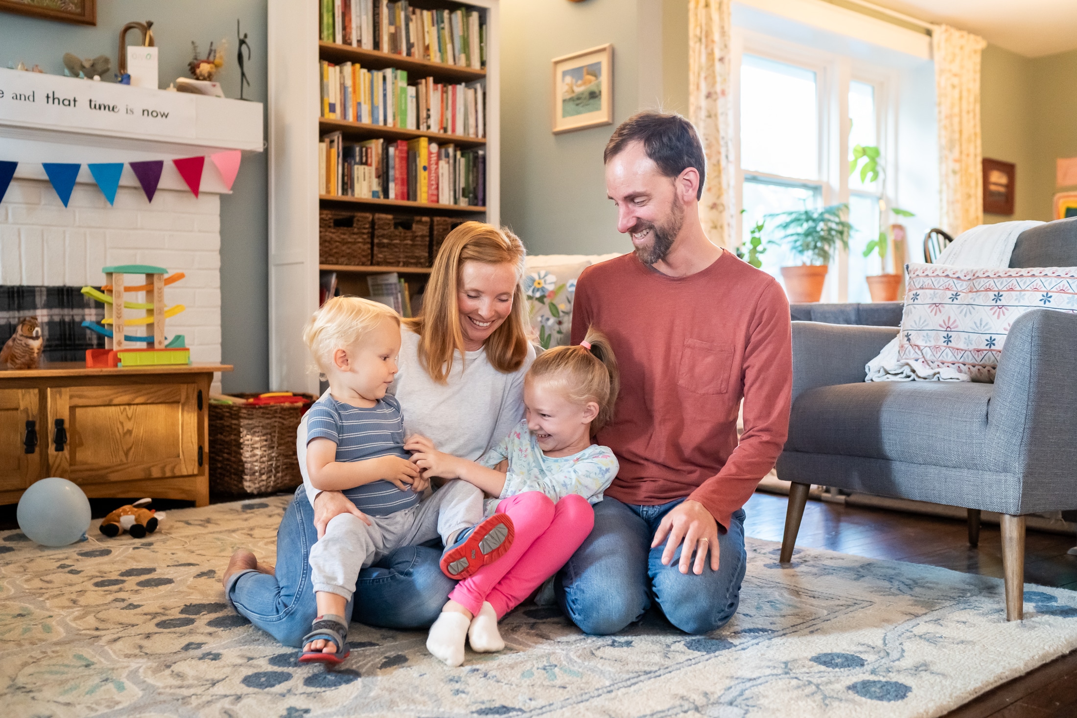 Candid family portrait capturing Jancey and her family's authentic joy and connection.