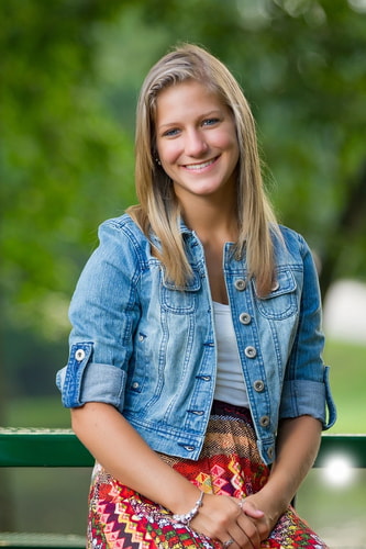Happy senior girl posing with a graduation cap