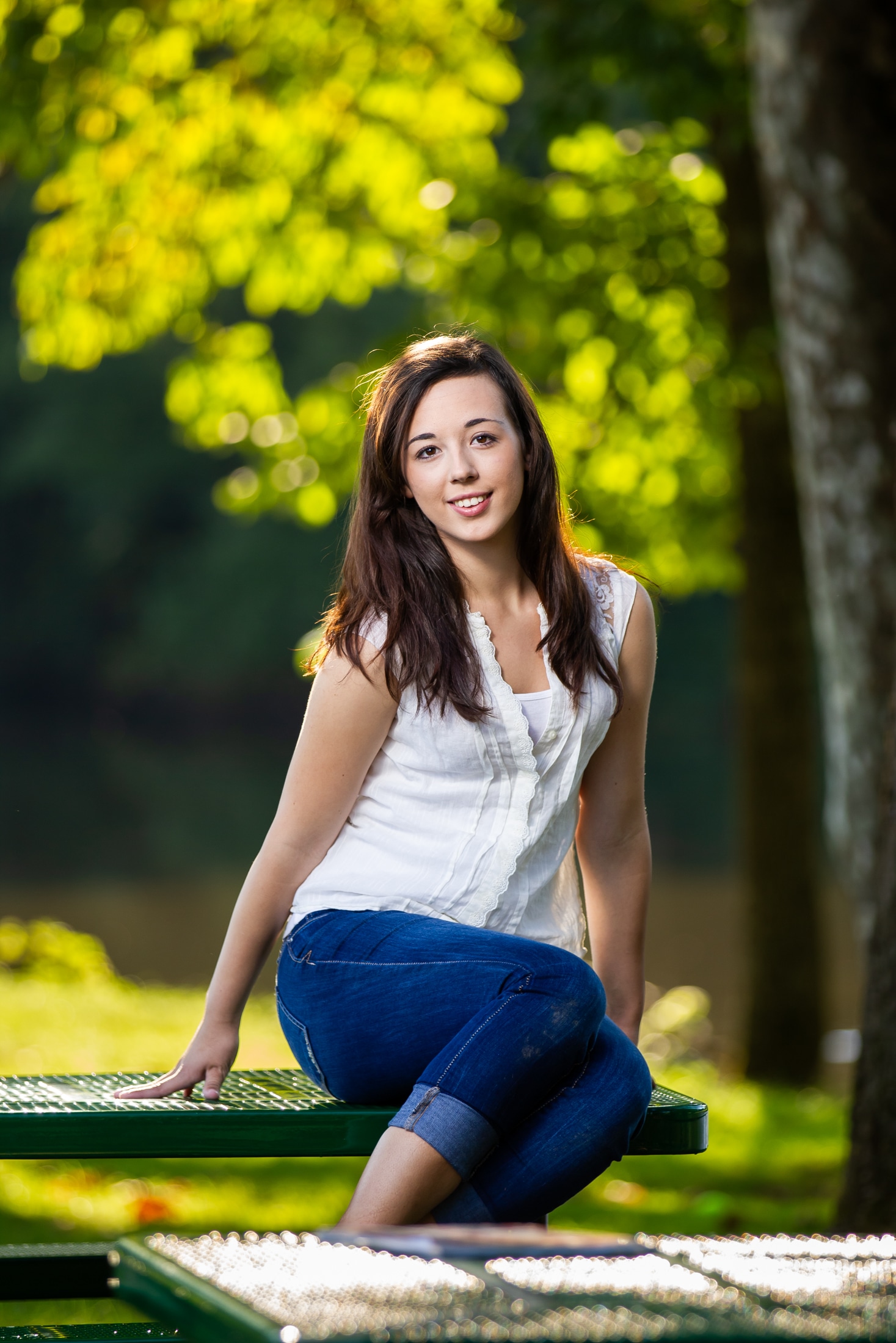 Streamside dreams: A candid portrait of Chelsea reflecting near the tranquil waters.