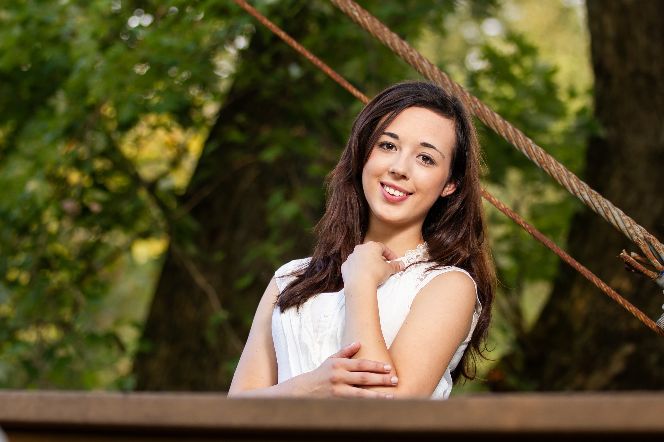 Bridging the gap: Chelsea confidently crossing the swinging bridge, symbolizing her transition to a new chapter.