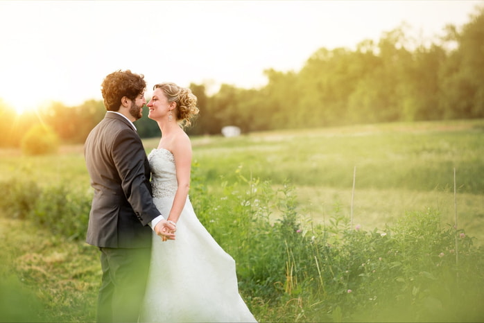 Bride and groom smiling during their romantic wedding portraits at Stone Barn Winery in Selinsgrove.